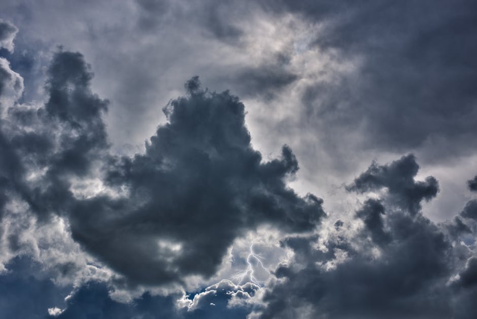 An intense storm sky showcasing dark clouds and vivid lightning, capturing nature's power.